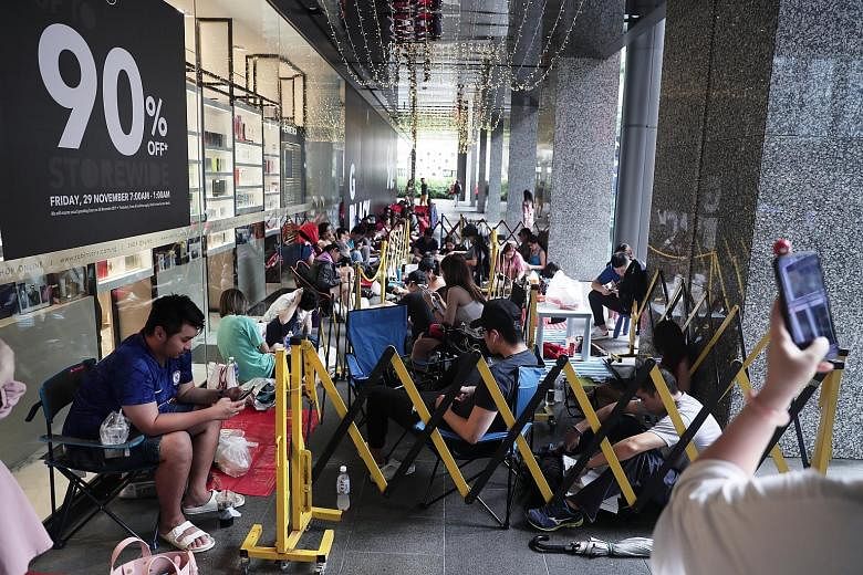 Around 50 people had parked themselves outside Robinsons The Heeren by 4pm yesterday to be among the first in line when the store's doors open at 7am today for its annual Black Friday sale, called The Great Blackout. The bargain hunters came armed wi