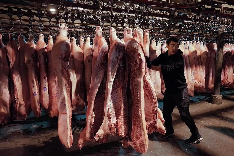 A wholesale pork market in Beijing. Pork prices in China have more than doubled since an African swine fever epidemic that hit in August last year, driving up consumer inflation and causing grumbling among the Chinese who find themselves unable to af