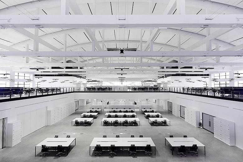 Dyson's Hullavington campus in Britain, where derelict airplane hangars were recently restored and transformed into modern workspaces. The campus had been earmarked as the development site for the firm's electric vehicle - complete with plans to inst