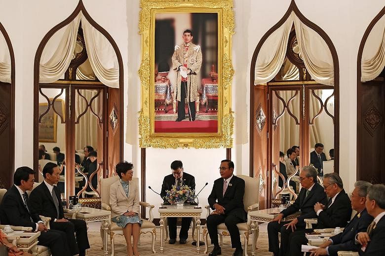 Hong Kong Chief Executive Carrie Lam meeting Thai Prime Minister Prayut Chan-o-cha at Government House in Bangkok yesterday. Among those present were Deputy Thai Prime Minister Somkid Jatusripitak (fourth from right) and Hong Kong Commerce and Econom