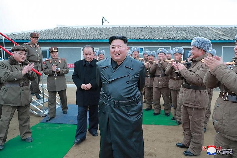 North Korean leader Kim Jong Un overseeing a super-large multiple launch rocket system test in a photo released by the country's KCNA news agency last Thursday. Mr Kim expressed "great satisfaction" over the North's fourth test of its new "super-larg