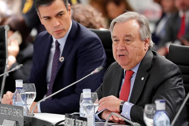UN chief Antonio Guterres speaking yesterday at the conference in Madrid. Beside him is Spain's acting Prime Minister Pedro Sanchez.