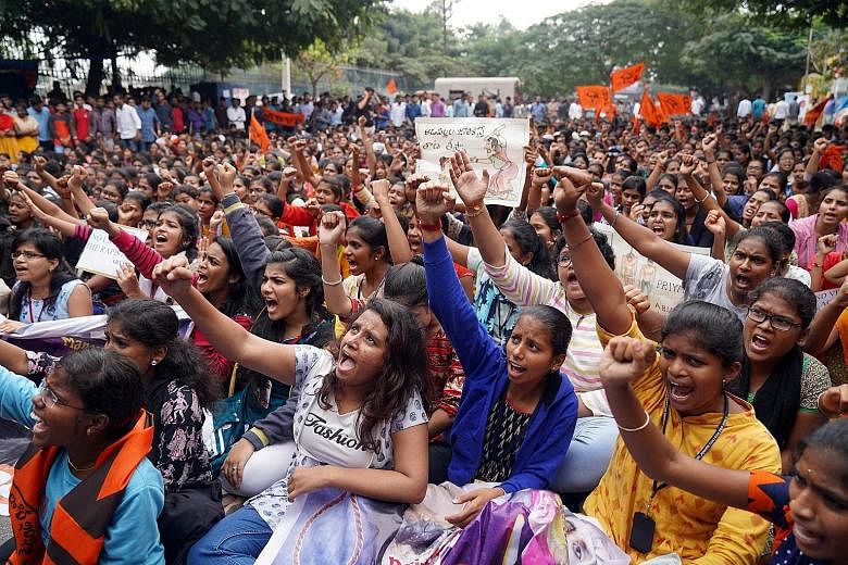 Protesters shouting slogans yesterday over the case of a 27-year-old veterinarian who was gang-raped and killed in Hyderabad last week.
