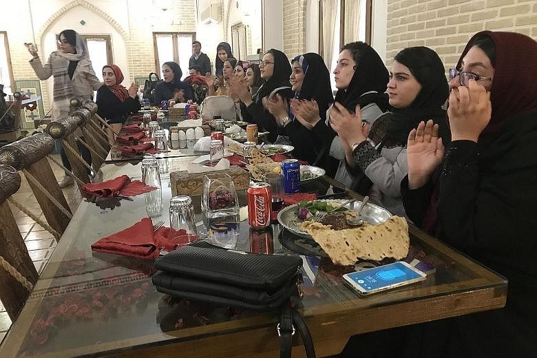 A group of Iranian women enjoying a meal and music in a restaurant in the city of Esfahan. Some women in Iran are again beginning to question why they should be forced to wear the hijab, which became compulsory after the Islamic Revolution in 1979. S
