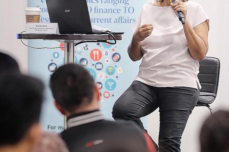 Straits Times senior education correspondent Sandra Davie speaking at an askST@NLB session last Friday at the Central Public Library. During the session, she explained the recent changes to the education system.