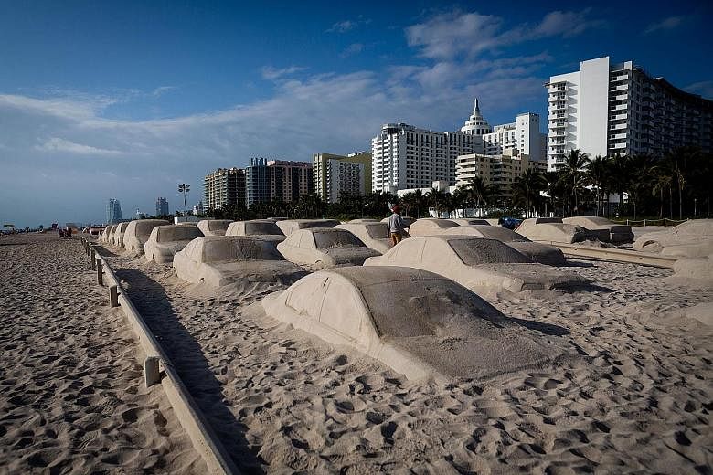 More than 60 car sand sculptures are drawing attention at the Art Basel international festival.