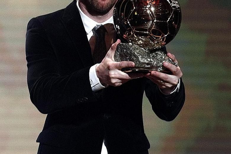 Lionel Messi, 32, is all smiles after picking up his sixth Ballon d'Or award in Paris on Monday night.