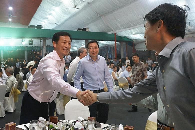 Education Minister Ong Ye Kung and Mr Bill Chang York Chye (centre), chairman of the Singapore Polytechnic board of governors, greeting a guest at Singapore Polytechnic's 65th anniversary gala dinner yesterday.
