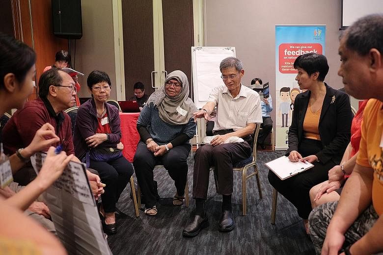 Second Minister for Finance Indranee Rajah (far right) joining in a small-group discussion during a pre-Budget dialogue yesterday. ST PHOTO: JASON QUAH