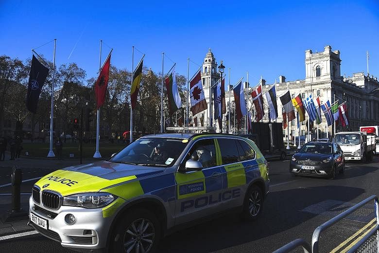 Flags of Nato member states in London, ahead of the group's summit today. The world's biggest military alliance marks its 70th birthday while battling one of its most confounding adversaries - itself. PHOTO: ASSOCIATED PRESS