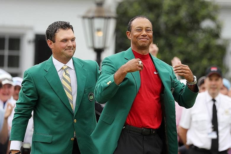 Tiger Woods basking in fans' adulation at the Masters in April after last year's champion Patrick Reed helps him wear the Green Jacket. It was Woods' fifth Masters win and 15th Major triumph, 11 years after his last.