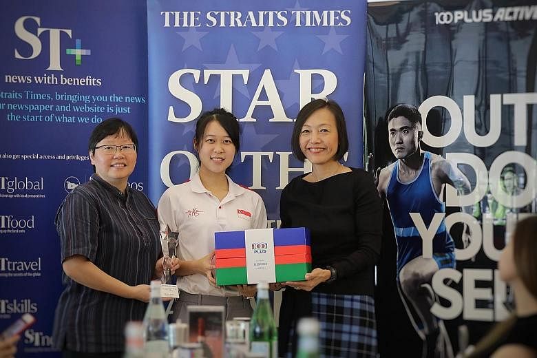 ST sports editor Lee Yulin (left) and F&N Foods managing director Jennifer See presenting Tessa Neo with the ST Star of the Month award yesterday. The shooter was the first Singaporean to win a medal in the women's 10m air rifle at the Asian Shooting