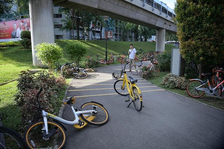 The refunds come from the halving of licensing fees for bike-sharing operators. The licensing regime was introduced last year to stop the rampant practice of bikes being parked in a haphazard manner. ST FILE PHOTO