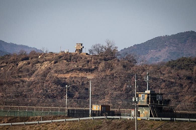 A South Korean sentry post (foreground) and a North Korean one facing each other across the border in Paju, Gyeonggi-do, South Korea. Activity at the North's Sohae rocket launch facility includes what appears to be a newly arrived shipping container 