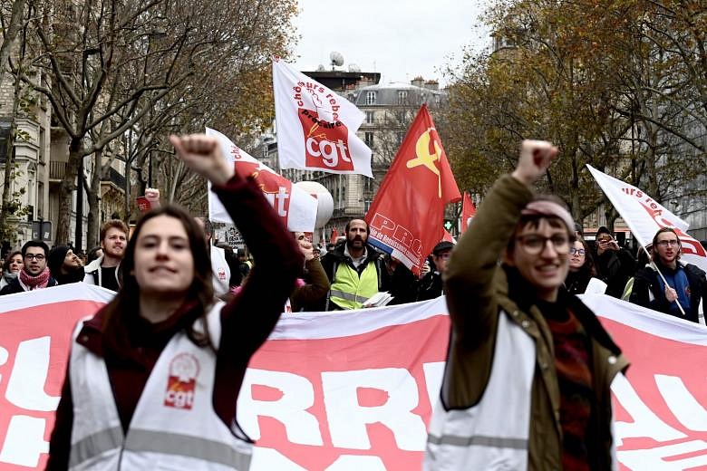 More French protests see roads blocked, trains disrupted and scuffles ...