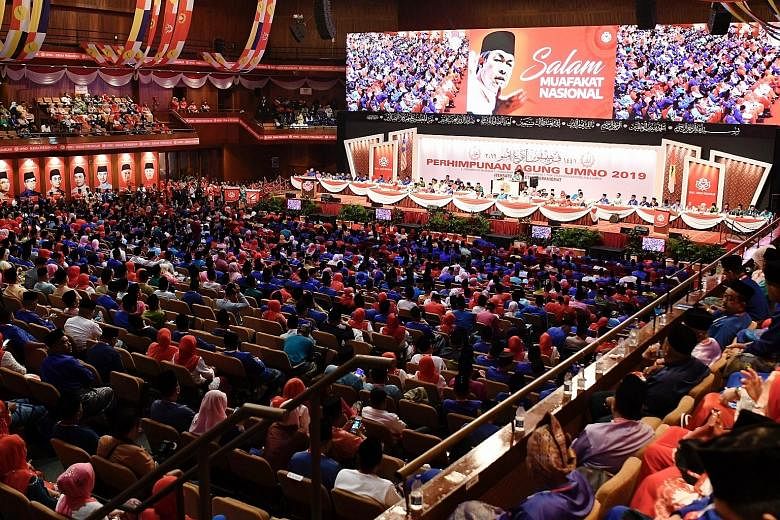 Delegates singing the party anthem at the Umno general assembly yesterday at Putra World Trade Centre, where it was announced that a new Malaysian opposition alliance, Muafakat Nasional, will be officiated next year.