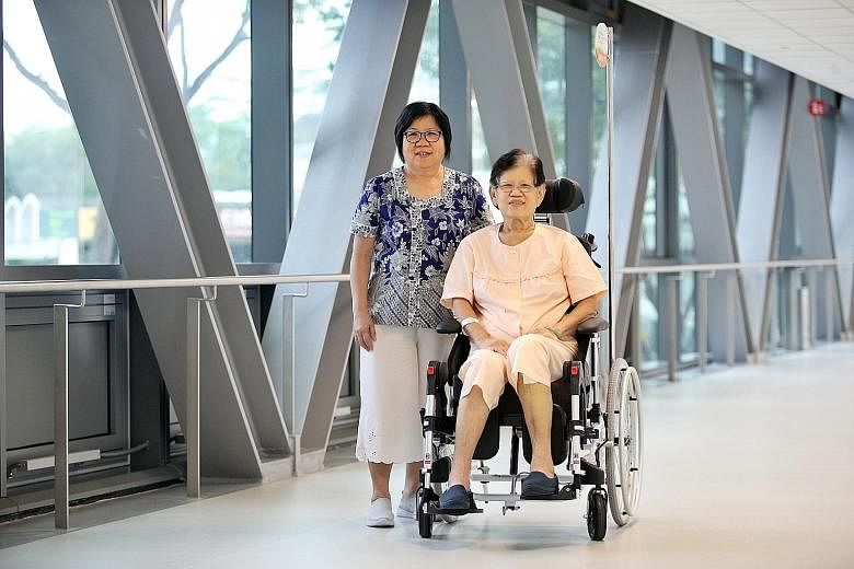 Above: Retired cashier Tng Sai Choo chose to recuperate at the Outram Community Hospital (OCH) after her knee replacement surgery at Singapore General Hospital (SGH) last month, so that it is easier for her sister Thng Lay Choo (left) to visit her. T