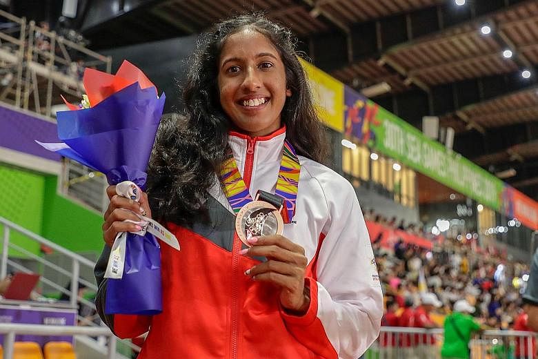 Shanti Pereira is happy with her bronze medal after finishing in 23.77sec - a season's best - in the 200m final yesterday.