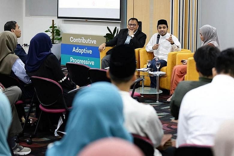 Deputy Mufti of Singapore, Dr Nazirudin Mohd Nasir (in white), at an engagement session with returning Islamic studies graduates on Thursday. PHOTO: MUIS