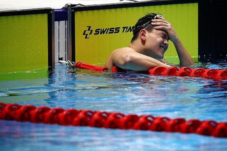 Joseph Schooling grimacing after the 100m freestyle final, which was won by 19-year-old Darren Chua. 