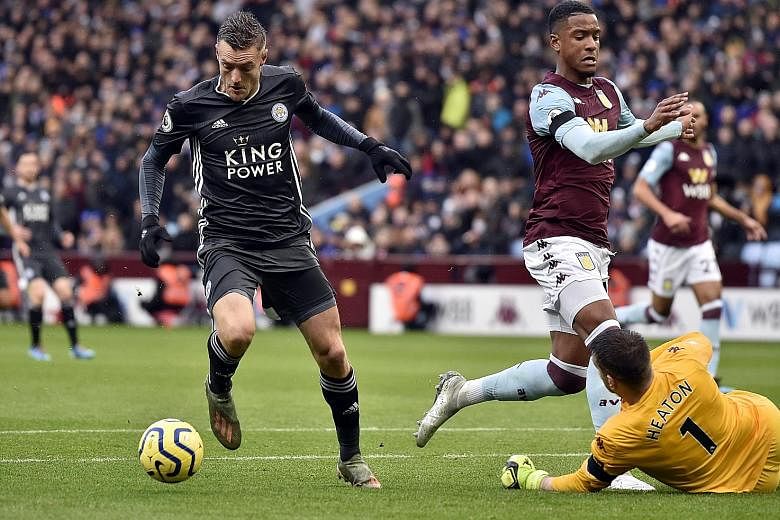 A brace from striker Jamie Vardy (far left) and goals from Kelechi Iheanacho and Jonny Evans gave the 2016 champions a comfortable 4-1 win over the newly promoted side to reach 38 points and cut Liverpool's lead at the top back to eight points. 