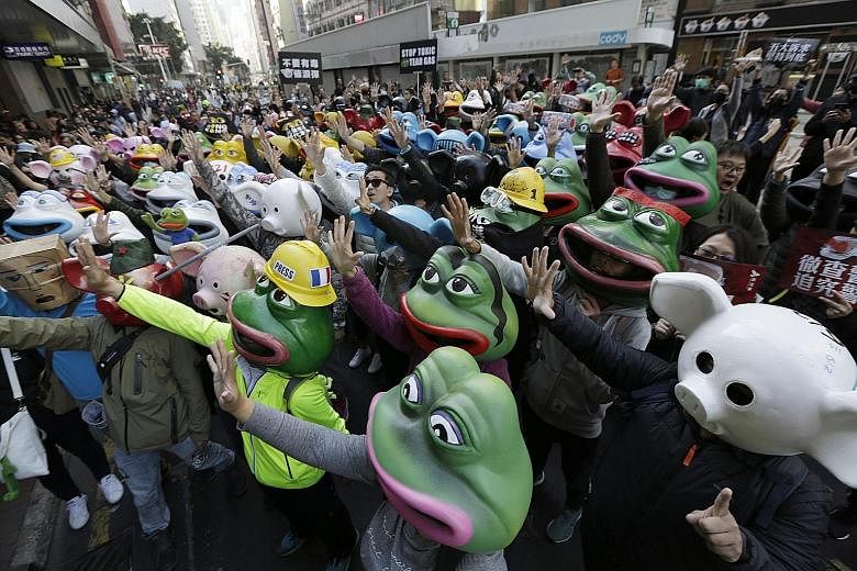 Pro-democracy protesters taking part in a rally in Hong Kong yesterday organised by the Civil Human Rights Front. Yesterday's event was the first march held by the Front to be approved in months, and people walked from Victoria Park in Causeway Bay t