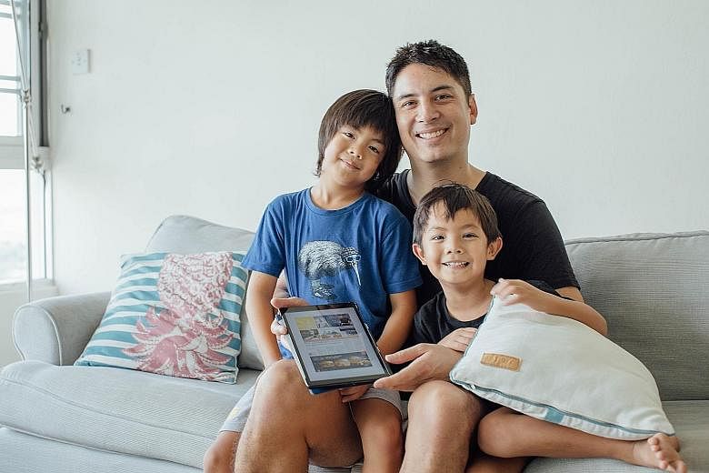 For Kiss92 FM deejay Shan Wee, the tablet is a great way for his children - Ciaran, seven, and Ruan, five - to learn English as technology takes an ever-increasing role in their lives. ST PHOTO: SAMUEL RUBY