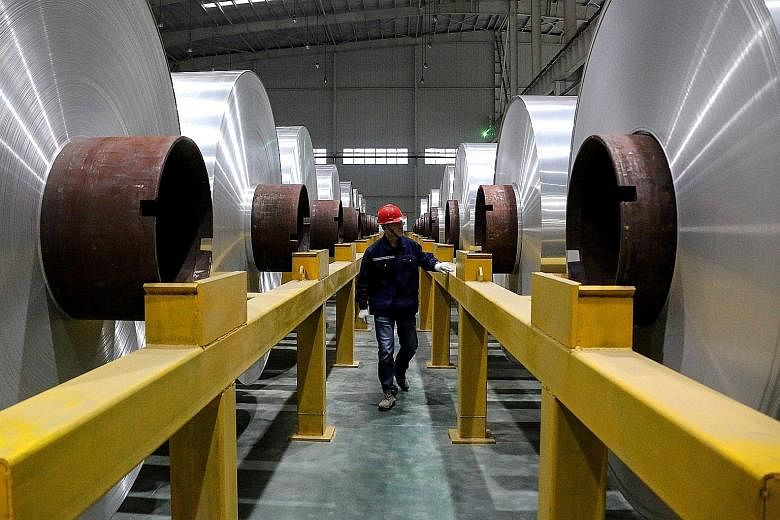An employee at the production line of aluminium rolls at a factory in Zouping, Shandong province. China's total exports last month dropped 1.1 per cent from a year ago, and shipments to the United States were down 23 per cent, the Customs administration s