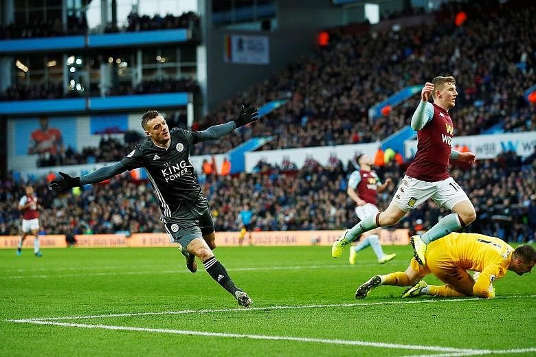 Jamie Vardy wheeling away after rounding off Leicester's 4-1 league win over Aston Villa at Villa Park on Sunday with his second goal.