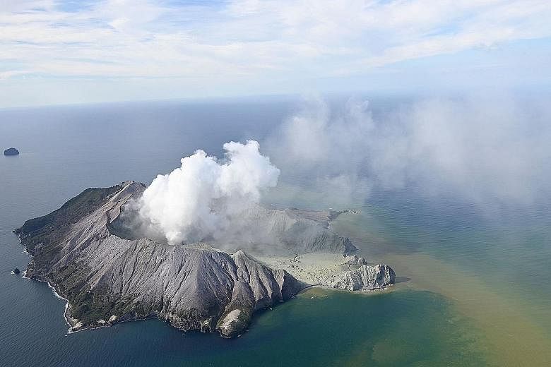 Plumes of smoke rising after White Island volcano erupted yesterday. Police said there were no more signs of life there after rescue helicopters and other aircraft conducted a number of aerial reconnaissance flights. Tourists fleeing New Zealand's Wh