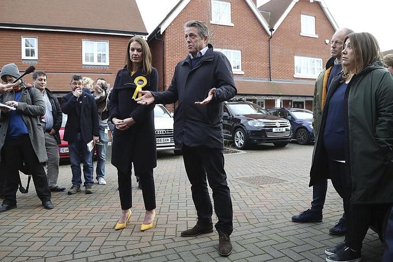 British actor Hugh Grant, who starred in the 2003 romantic comedy Love, Actually, on the campaign trail with Liberal Democrat candidate Monica Harding in Walton-on-Thames at the weekend.