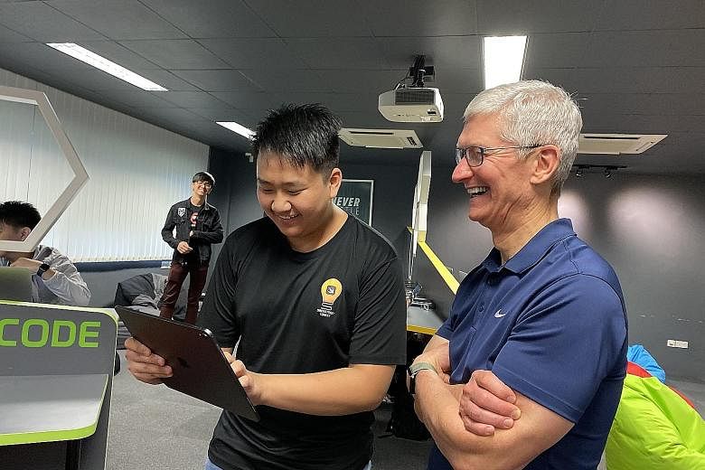 Apple chief executive Tim Cook with Sean Wong, 16, a Ngee Ann Secondary student who has completed Apple's Swift Accelerator programme.