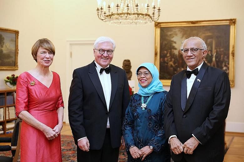 President Halimah Yacob and her husband, Mr Mohamed Abdullah Alhabshee, at a state banquet held in her honour at the Schloss Bellevue in Berlin on Tuesday. She was hosted by German President Frank-Walter Steinmeier, who was accompanied by his wife, M