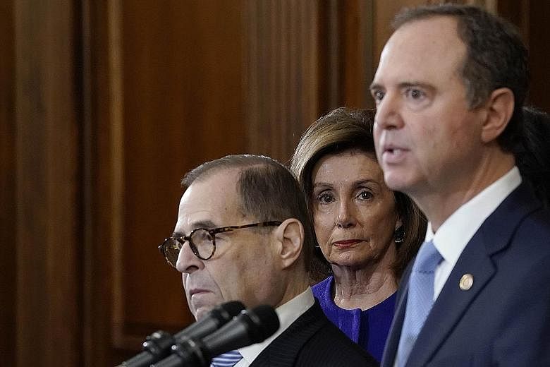 Speaker Nancy Pelosi listening as Mr Adam Schiff (right) and Mr Jerry Nadler announced the next steps in the House impeachment inquiry at the US Capitol in Washington on Tuesday.