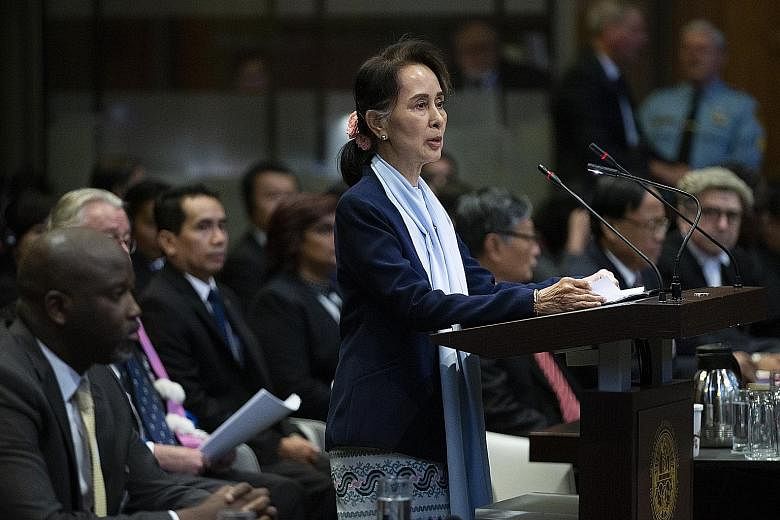 Myanmar's de facto leader Aung San Suu Kyi addressing judges of the International Court of Justice as Gambia's Justice Minister Abubacarr Tambadou (left) listened, on the second day of three days of hearings in The Hague. Gambia had brought the case 