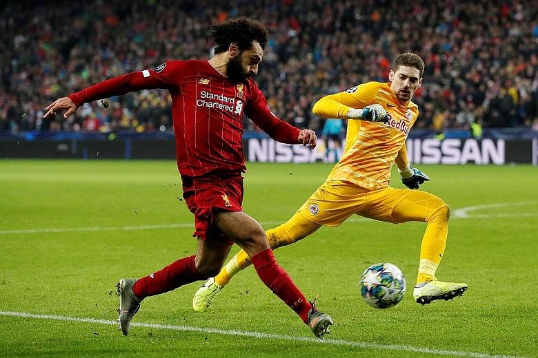 Having missed a host of easy chances, Mohamed Salah got the breakthrough with a neat finish from a tight angle for Liverpool's second goal. The 2-0 win over Salzburg on Tuesday ensured top place in Group E of the Champions League for the Reds, ahead 