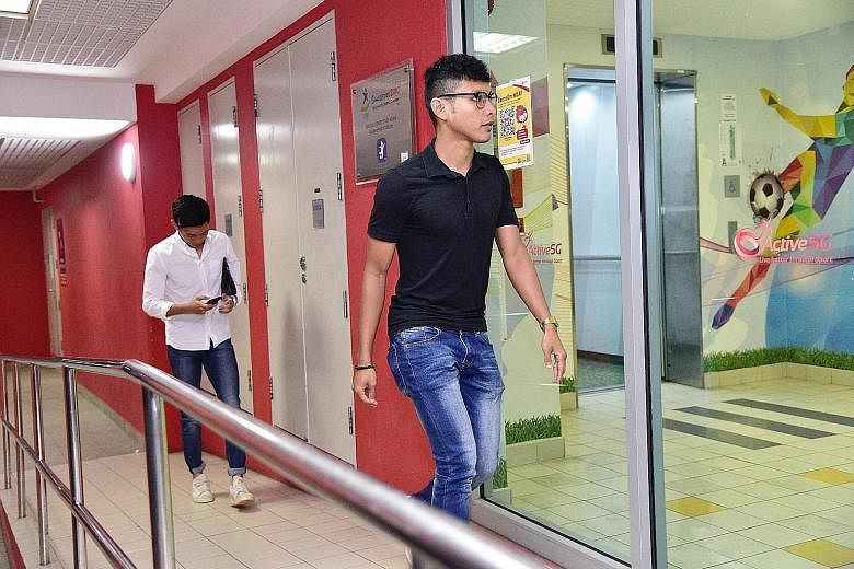 Zulqarnaen Suzliman (front) and Joshua Pereira arriving at the Football Association of Singapore headquarters at Jalan Besar Stadium for their disciplinary hearing last night. ST PHOTO: DESMOND WEE