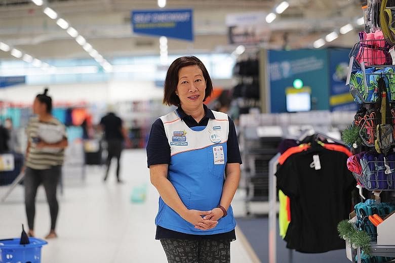 When Ms Lim Su-Lin returned to the workforce in 2016, she expected to be just a cashier, but the courses she did enabled her to take on more complex jobs. ST PHOTO: KELVIN CHNG