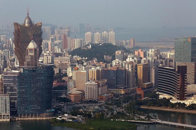 Chinese officials, and bankers in Hong Kong, say the push to develop financial infrastructure in Macau (above) is part of a plan to prevent Chinese businesses from being hit by any major market disruption in Hong Kong. PHOTO: REUTERS