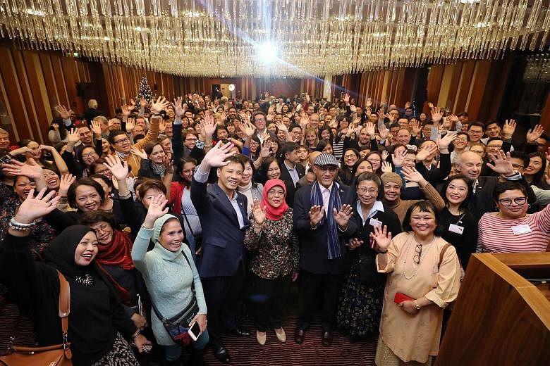 President Halimah Yacob with the more than 200 Singaporeans who attended a reception at Jumeirah Frankfurt hotel on Wednesday. Madam Halimah is flanked by Singapore's Ambassador to Germany Laurence Bay (left) and her husband, Mr Mohamed Abdullah Alha