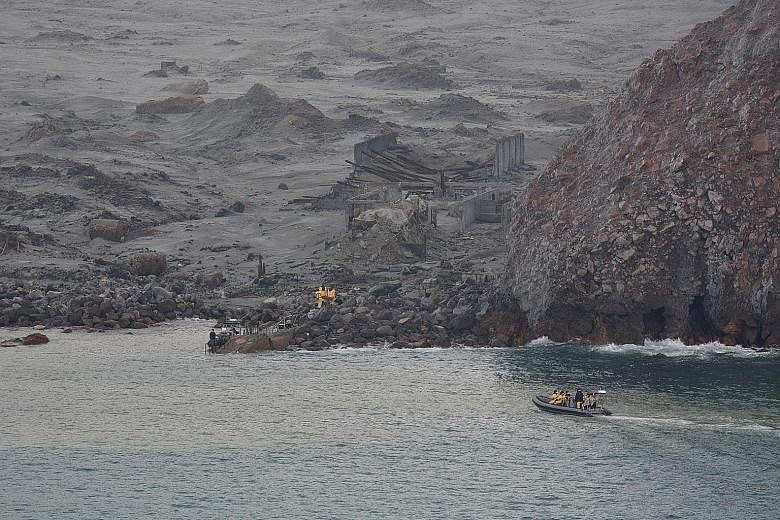 A photo from the New Zealand Defence Force showing yesterday's operation to recover bodies from White Island after a volcanic eruption in Whakatane on Monday. Drone flights had helped locate six bodies on the caldera before the operation began. Two m
