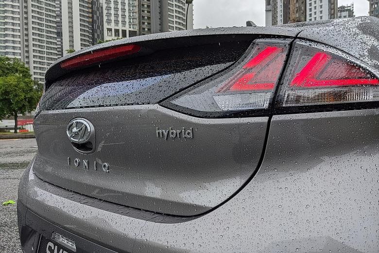 The Hyundai Ioniq Hybrid, in its latest facelift, gets new LED headlights and daytime-running lights with Hyundai's "cascading" front grille, as well as arrow-shaped LED taillights that give it a distinctive appearance (above). A new 8-inch touchscreen in