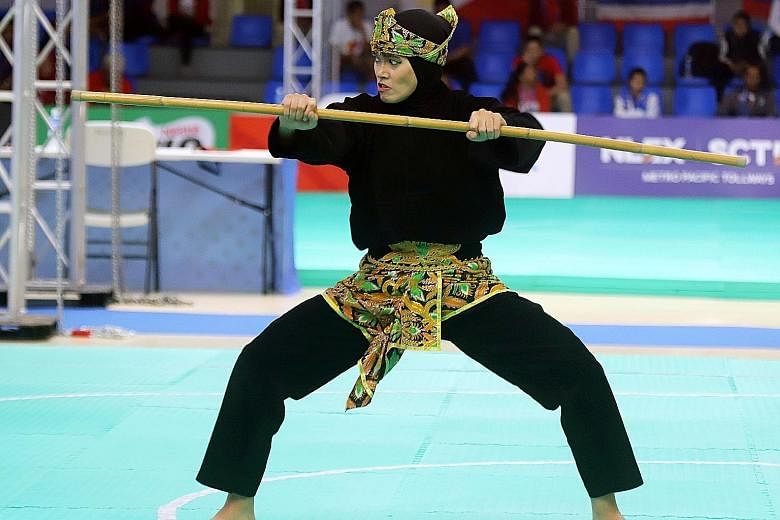 Indonesia's Puspa Arum Sari competing last week in a women's pencak silat event at the SEA Games held in the Philippines. Unesco says the sport contains "mental-spiritual, self-defence and artistic aspects".