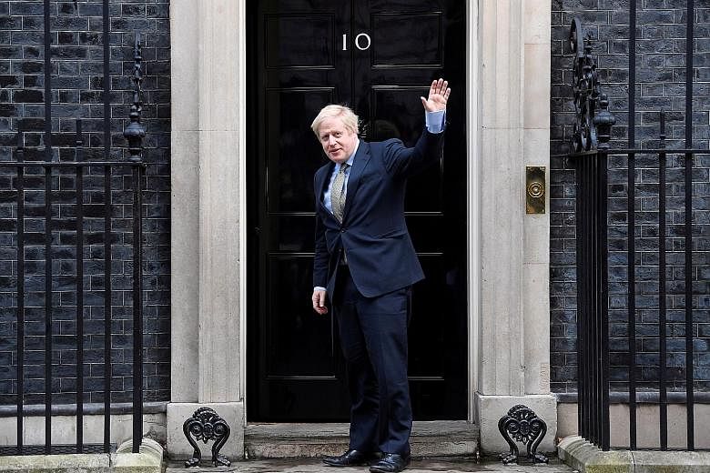 British Prime Minister Boris Johnson arriving at 10 Downing Street yesterday after meeting Queen Elizabeth at Buckingham Palace to ask for permission to form a government. The Conservatives won 365 out of 650 seats in the House of Commons.