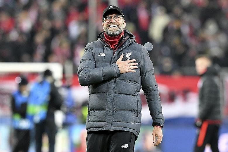 Liverpool manager Jurgen Klopp beaming at the end of their Champions League victory over hosts Salzburg on Tuesday. The Reds won 2-0 to qualify for the round of 16.