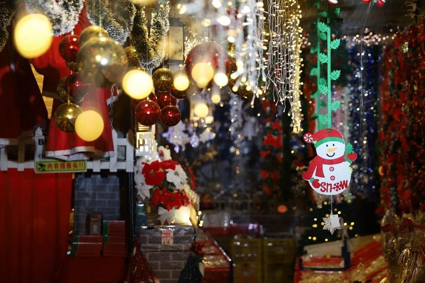 Visitors are greeted with baubles and fairy lights upon entering the store.
