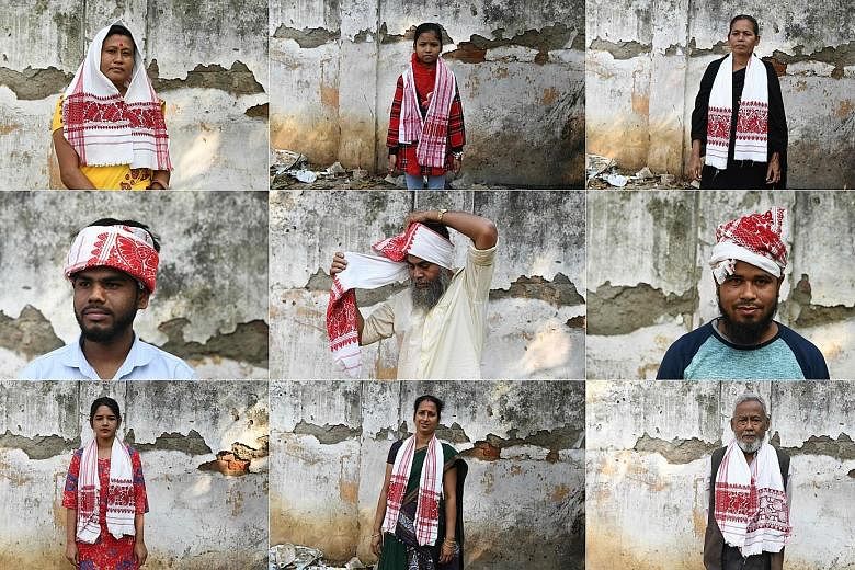 Protesters and police facing off during a demonstration against the new law, in Howrah, on the outskirts of Kolkata, yesterday. Protesters wearing traditional Assamese scarves posing for photographs yesterday before they joined a protest against the 