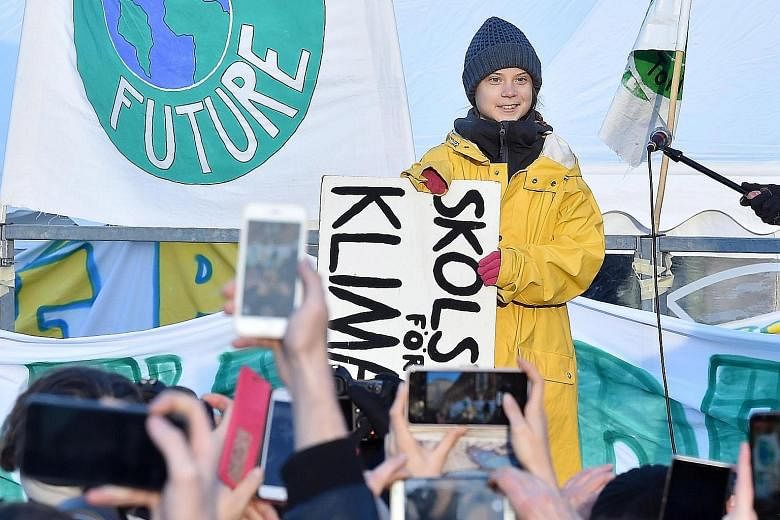 Swedish activist Greta Thunberg, 16, leading a Fridays For Future rally demanding action against climate change, at Piazza Castello in Turin, northern Italy, on Friday. PHOTO: EPA-EFE