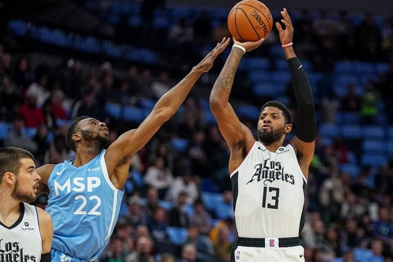 Clippers forward Paul George, shooting over his Timberwolves counterpart Andrew Wiggins, on his way to a game-high 46 points. 