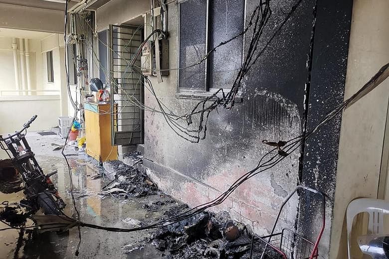 A personal mobility device left charging in the common corridor of Block 715 Clementi West Street 2 resulted in a fire on Dec 5 that led to three residents being evacuated. PHOTO: SCDF/FACEBOOK